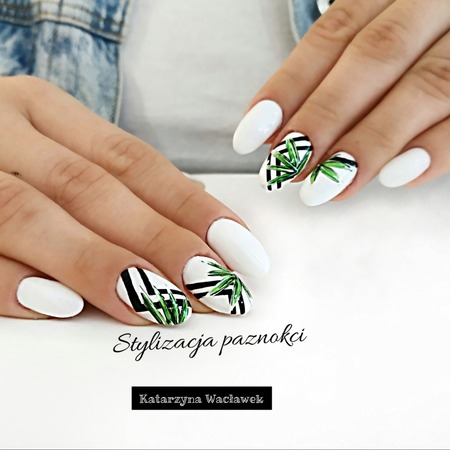 Manicure żelowy - białe owalne paznokcie z liściastymi wzorami